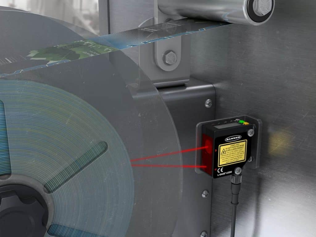 carretel de etiqueta, medição laser, precisão, sensor laser de medição.